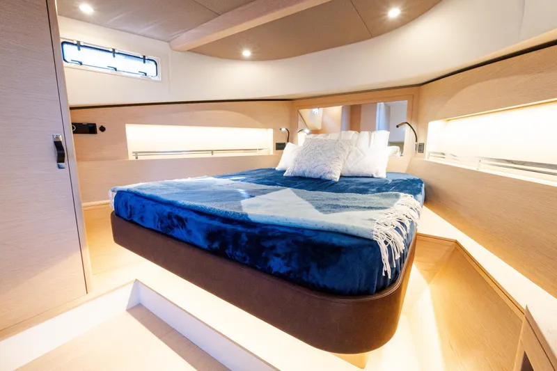 Slide: The Image of Luxurious interior cabin of 2023 Solaris Power 44 Open yacht with cozy bedding. - 34