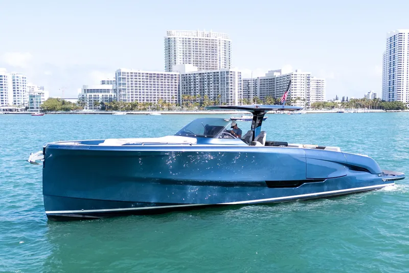 Slide: The Image of 2023 Solaris Power 44 Open yacht cruising near city skyline. - 4