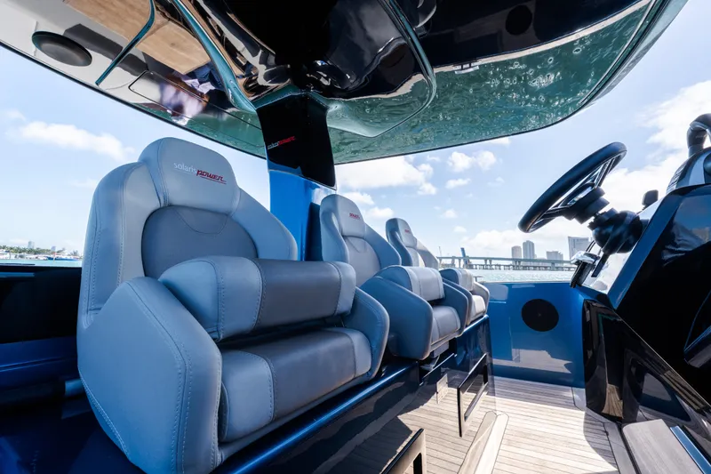 Slide: The Image of Luxurious interior of 2023 Solaris Power 44 Open yacht with plush seating and modern helm. - 44