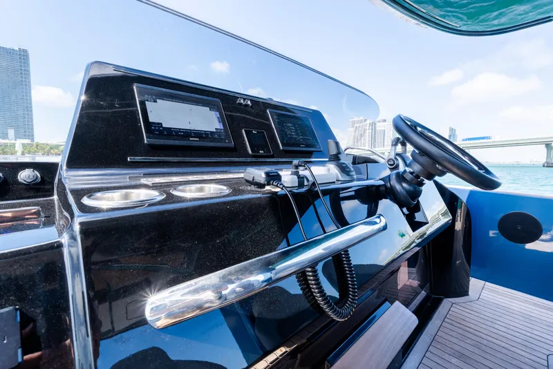 Slide: The Image of Helm of 2023 Solaris Power 44 Open yacht with modern navigation equipment. - 48