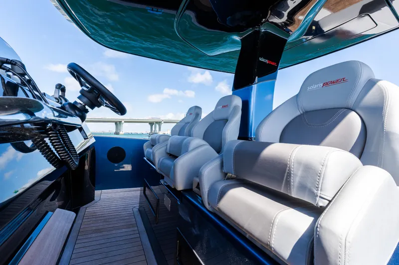 Slide: The Image of 2023 Solaris Power 44 Open luxury boat interior with sleek seating and modern design. - 49