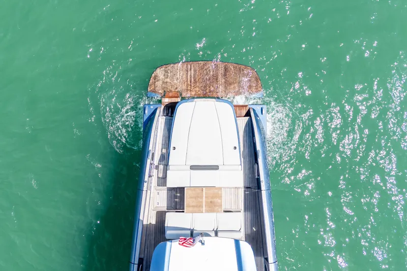Slide: The Image of Aerial view of 2023 Solaris Power 44 Open yacht on turquoise water. - 5