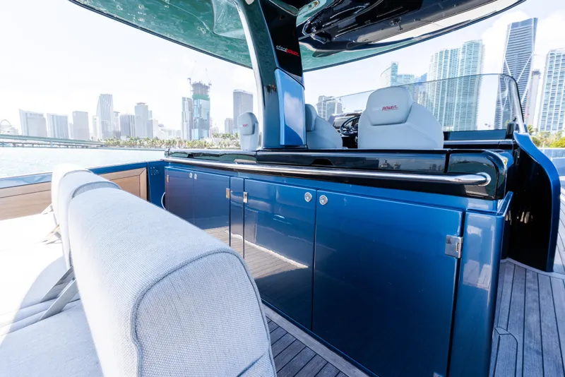 Slide: The Image of 2023 Solaris Power 44 Open yacht interior with city skyline in the background. - 59