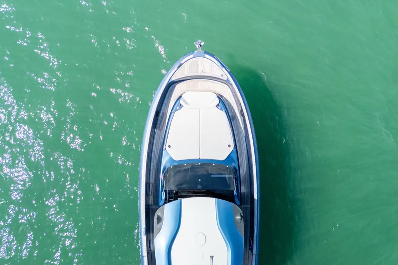 Slide: The Image of Aerial view of 2023 Solaris Power 44 Open yacht on turquoise water. - 6