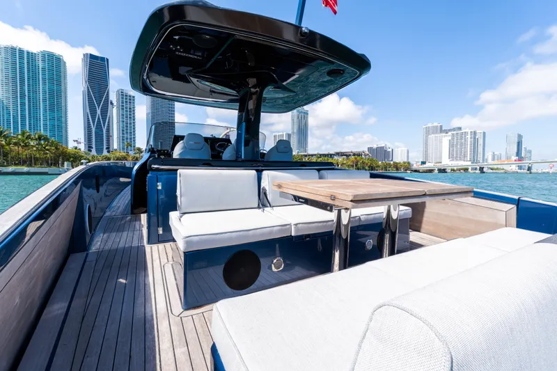 Slide: The Image of 2023 Solaris Power 44 Open yacht with modern seating, city skyline in background. - 60