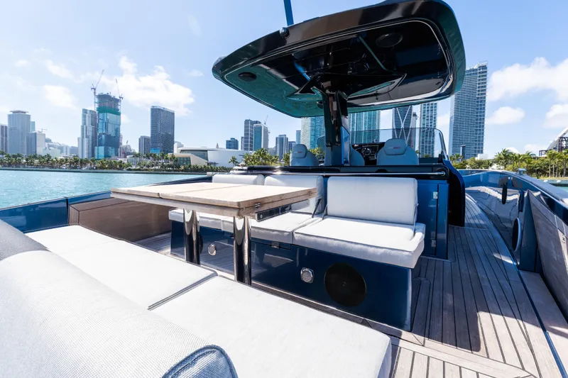 Slide: The Image of 2023 Solaris Power 44 Open yacht with modern seating, city skyline in background. - 61