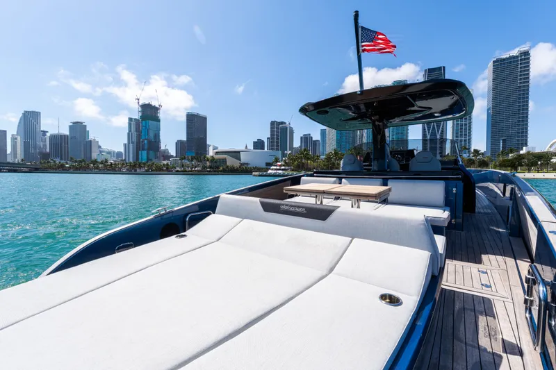 Slide: The Image of 2023 Solaris Power 44 Open yacht with city skyline and American flag. - 63