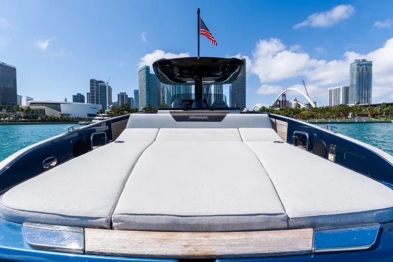 Slide: The Image of 2023 Solaris Power 44 Open yacht with city skyline and American flag. - 64