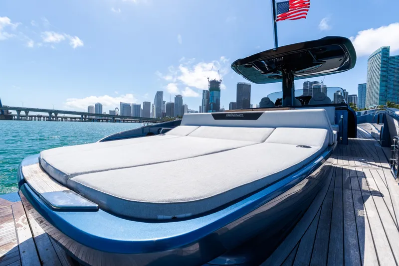 Slide: The Image of 2023 Solaris Power 44 Open yacht docked with city skyline in background. - 66