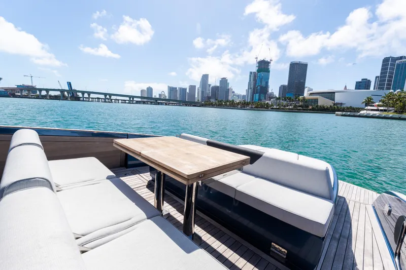 Slide: The Image of Luxurious 2023 Solaris Power 44 Open yacht with city skyline and waterfront view. - 68