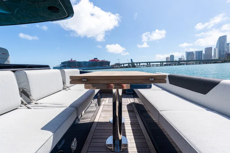 Slide: The Image of 2023 Solaris Power 44 Open yacht with city skyline and cruise ship in background. - 73