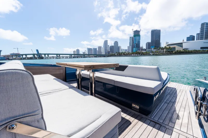 Slide: The Image of Luxurious 2023 Solaris Power 44 Open yacht with city skyline and waterfront view. - 74