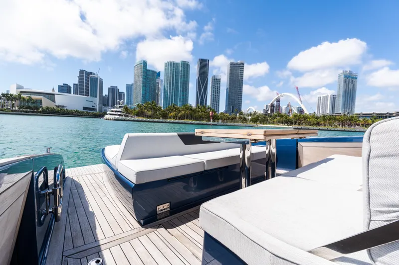 Slide: The Image of Luxurious 2023 Solaris Power 44 Open yacht with city skyline view, sunny day. - 75