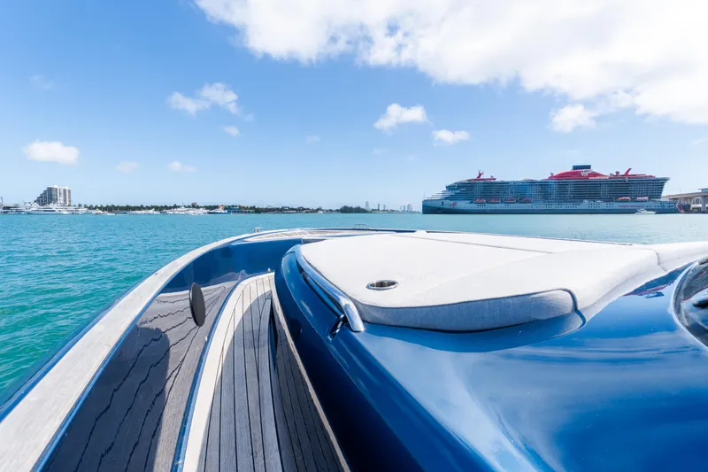 Slide: The Image of 2023 Solaris Power 44 Open yacht on blue water with cruise ship in background. - 81