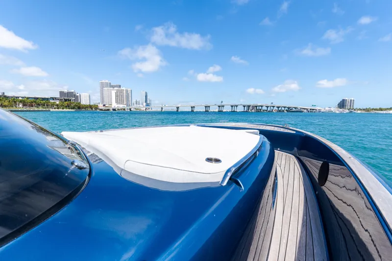 Slide: The Image of 2023 Solaris Power 44 Open yacht cruising near city skyline and bridge. - 87