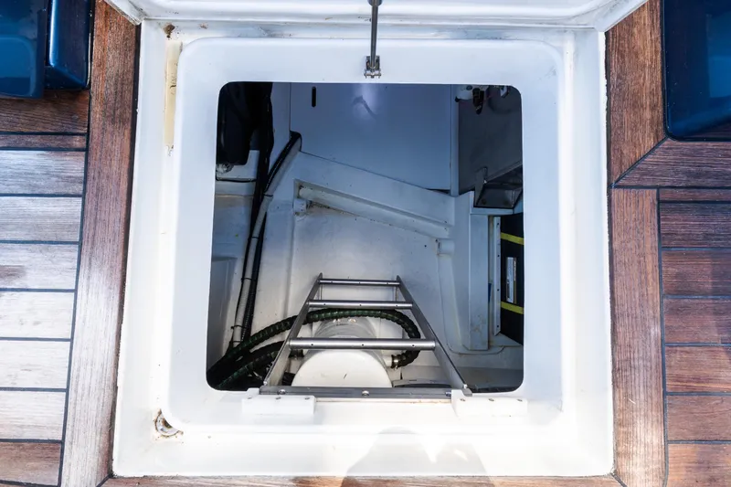 Slide: The Image of Engine compartment access on 2023 Solaris Power 44 Open yacht with wooden deck. - 88