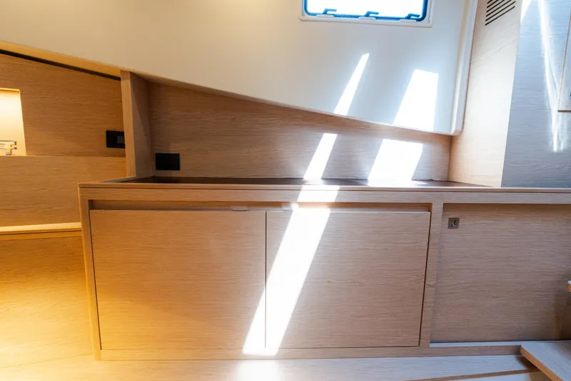 Slide: The Image of Interior of 2023 Solaris Power 44 Open yacht with modern wooden cabinetry and natural light. - 89