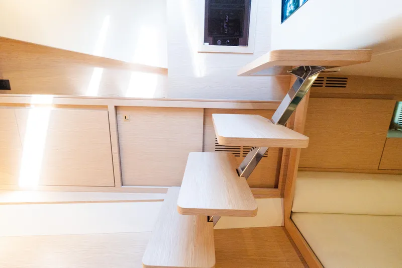 Slide: The Image of Modern interior of 2023 Solaris Power 44 Open yacht with sleek wooden staircase. - 90