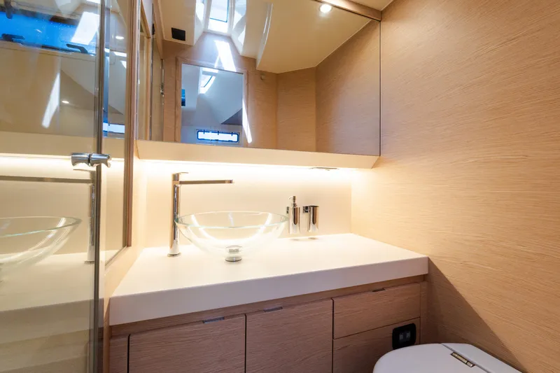 Slide: The Image of Luxurious bathroom interior of 2023 Solaris Power 44 Open yacht, featuring modern glass sink. - 92