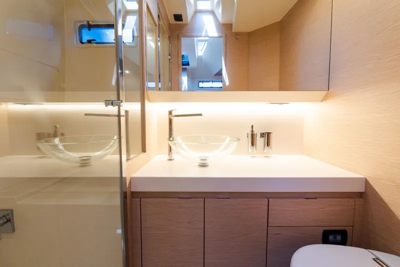 Slide: The Image of Luxurious bathroom interior of 2023 Solaris Power 44 Open yacht, featuring modern glass sink and sleek design. - 93