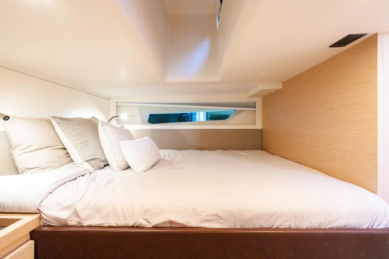 Slide: The Image of Luxurious cabin interior of 2023 Solaris Power 44 Open yacht, featuring a cozy bed and modern design. - 99