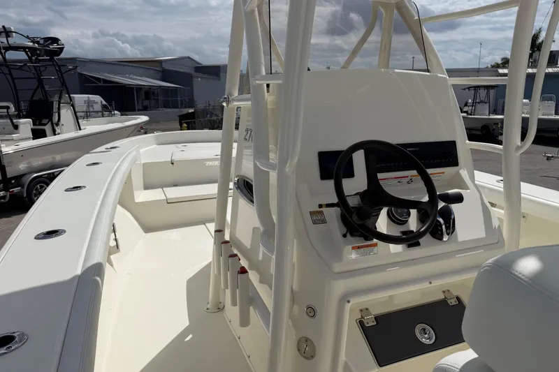 Slide: The Image of 2026 Pathfinder 2700 Open boat interior with steering console and seating. - 10