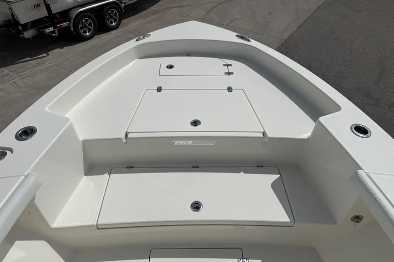 Slide: The Image of 2026 Pathfinder 2700 Open boat deck with storage compartments and sleek design. - 11