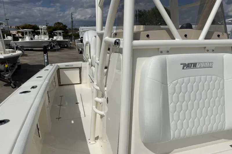 Slide: The Image of 2026 Pathfinder 2700 Open boat interior with white seating and sleek design. - 13
