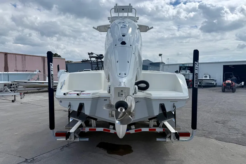 Slide: The Image of 2026 Pathfinder 2700 Open boat on trailer, rear view, cloudy sky background. - 4