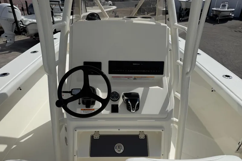 Slide: The Image of 2026 Pathfinder 2700 Open boat console with steering wheel and controls. - 9