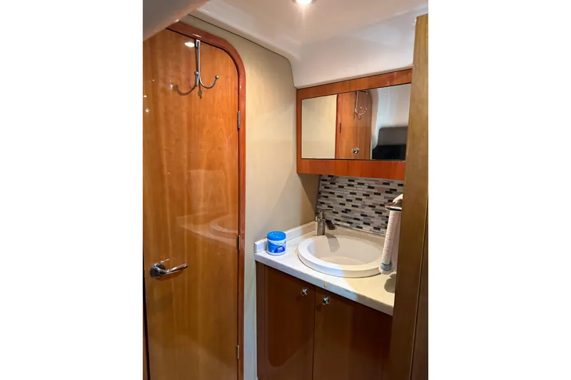 Slide: The Image of Luxurious 2012 Regal 46 Sport Coupe bathroom with wood accents and modern fixtures. - 17