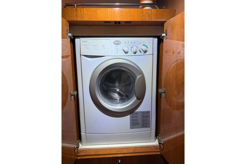 Slide: The Image of Built-in washing machine inside a 2012 Regal 46 Sport Coupe yacht cabinet. - 18