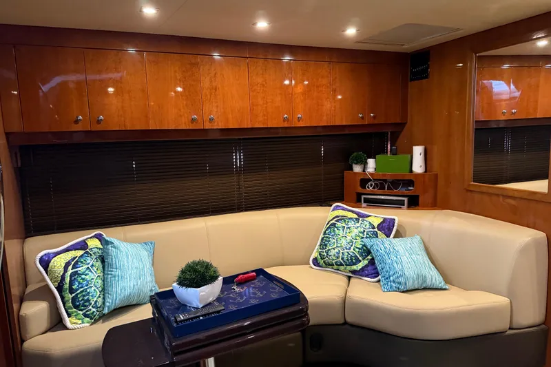 Slide: The Image of Luxurious interior of 2012 Regal 46 Sport Coupe with plush seating and vibrant cushions. - 21