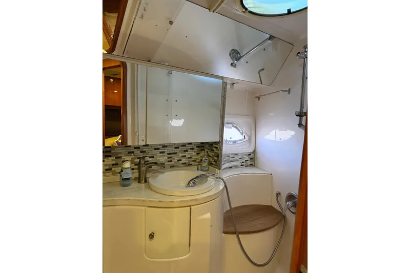 Slide: The Image of Luxurious bathroom in 2012 Regal 46 Sport Coupe yacht with modern fixtures and elegant design. - 24