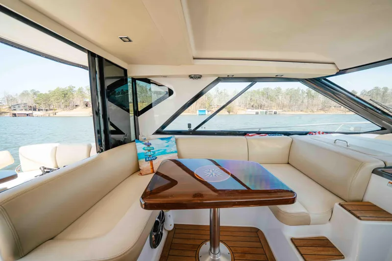 Slide: The Image of Luxurious interior of 2012 Regal 46 Sport Coupe yacht with scenic water view. - 29