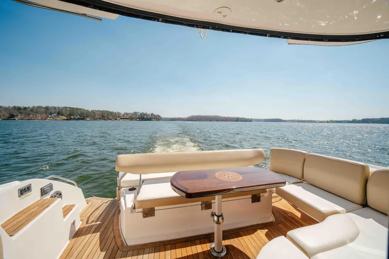 Slide: The Image of Rear view of 2012 Regal 46 Sport Coupe yacht on a sunny lake. - 32