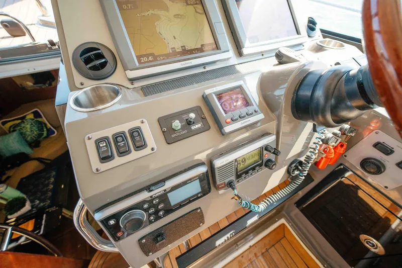 Slide: The Image of Control panel of a 2012 Regal 46 Sport Coupe with navigation and communication equipment. - 38