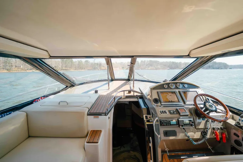 Slide: The Image of Interior view of 2012 Regal 46 Sport Coupe yacht cockpit with navigation controls. - 41
