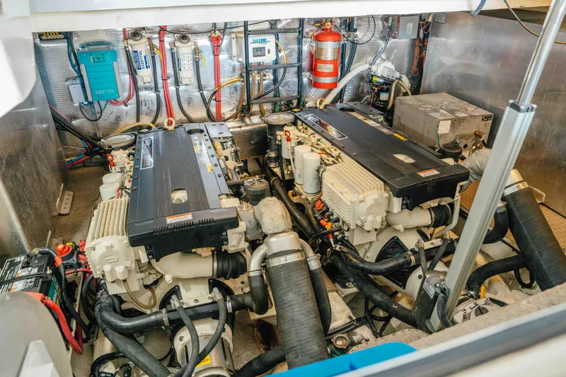 Slide: The Image of Engine room of 2012 Regal 46 Sport Coupe with dual engines and equipment. - 49