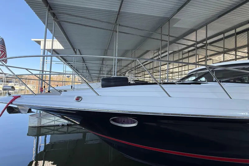 Slide: The Image of 2012 Regal 46 Sport Coupe yacht docked under covered marina. - 5