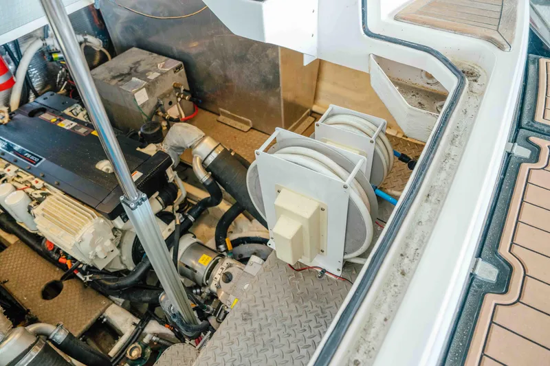 Slide: The Image of Engine compartment of a 2012 Regal 46 Sport Coupe, showcasing mechanical components and wiring. - 51