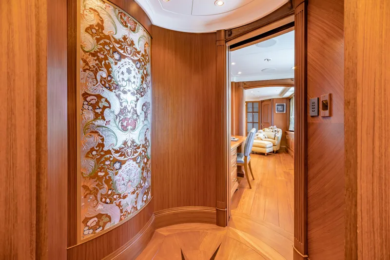 Slide: The Image of Luxurious yacht interior with ornate wood paneling and elegant furnishings, Burger Custom 2010 model. - 12