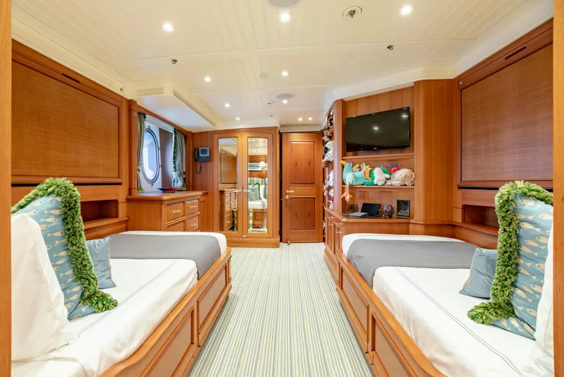 Slide: The Image of Luxurious yacht cabin with twin beds, wooden decor, and modern amenities, Burger Custom 2010 model. - 27