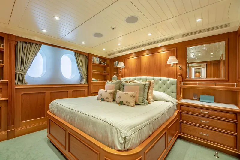 Slide: The Image of Luxurious yacht bedroom with elegant wood paneling and plush bedding, 2010 Burger Custom. - 29