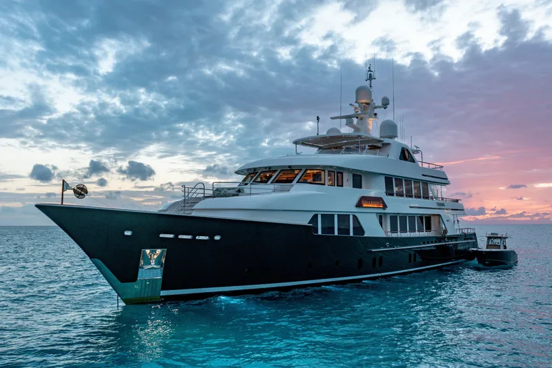 Slide: The Image of Luxurious 2010 Burger Custom yacht at sunset on tranquil ocean waters. - 34