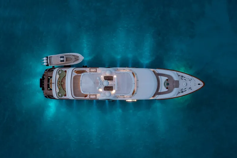 Slide: The Image of Aerial view of a 2010 Burger Custom yacht illuminated on blue water. - 35