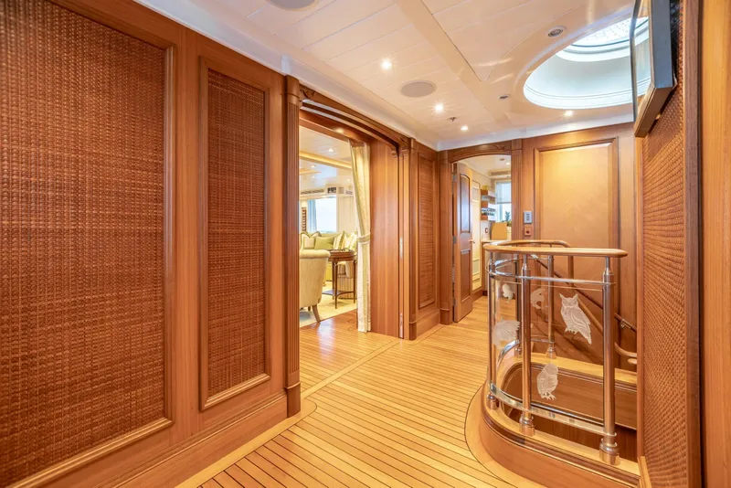 Slide: The Image of Luxurious yacht interior with wooden paneling and elegant staircase, Burger Custom 2010 model. - 37