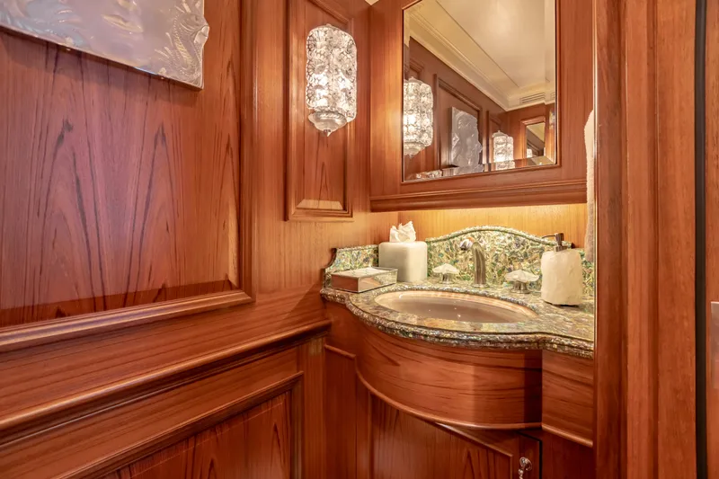 Slide: The Image of Luxurious wooden bathroom with ornate sink and elegant lighting on a 2010 custom Burger model. - 39