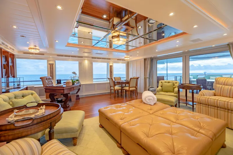 Slide: The Image of Luxurious yacht interior with ocean view, featuring elegant seating and wooden accents, 2010 Burger Custom. - 41