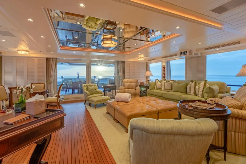 Slide: The Image of Luxurious yacht interior with elegant seating, ocean view, and warm lighting, Burger Custom 2010 model. - 43